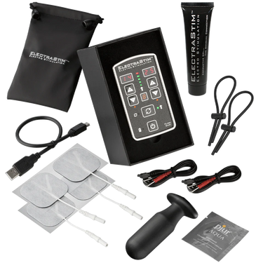 a black box with a pair of scissors and other items